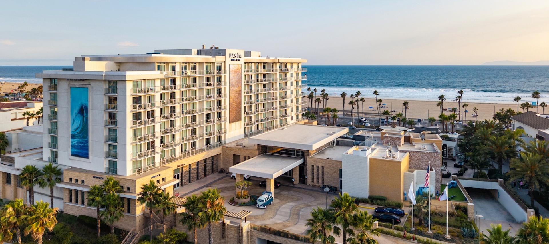 Paséa Hotel & Spa from above at sunset, with Huntington Beach and the ocean behind it