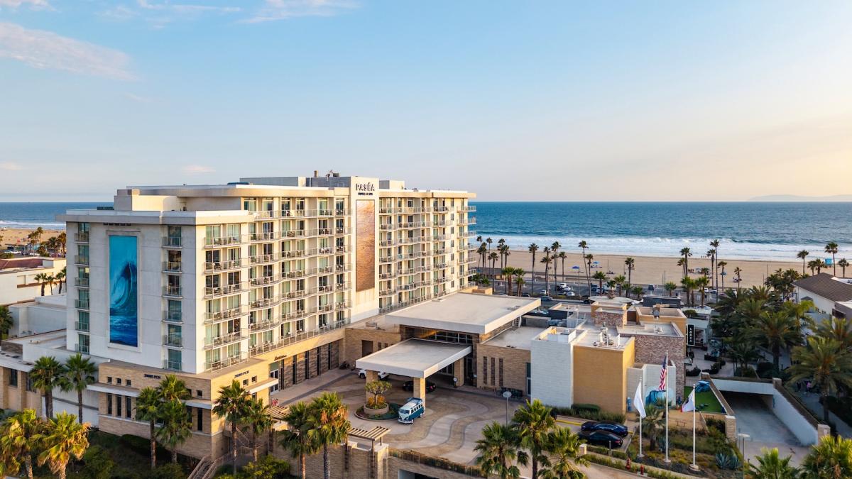 Paséa Hotel & Spa from above at sunset, with Huntington Beach and the ocean behind it